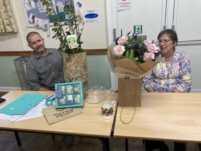 Kevin Wakeham presenting outgoing Clerk Jan Cook with her retirement gifts from Councillors.